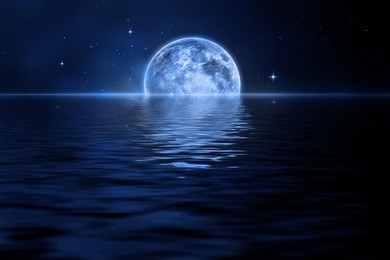 rising moon over sea