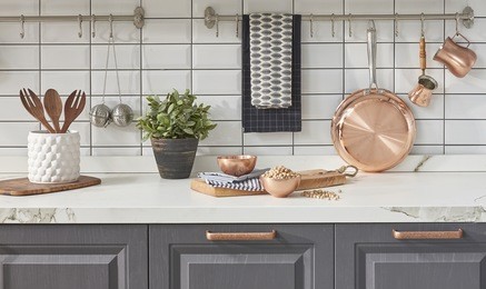 modern kitchen chopping board behind white tile wall interior trend