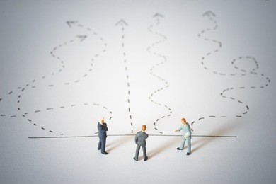 business decision concept. businessmen standing and giving advice with arrow pathway choice. 