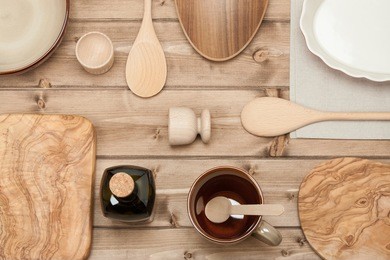 cooking tools. kitchenware. olive wood chopping board. top view. wooden table.