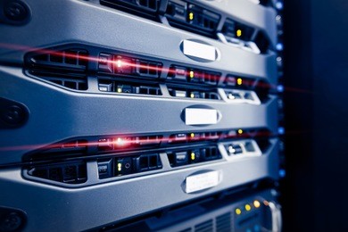 computer server mount on rack in data center room with red lighting alarm.