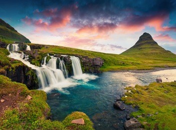 summer sunset on famous kirkjufellsfoss waterfall and kirkjufell mountain. colorful evening scene on snaefellsnes peninsula, iceland, europe. artistic style post processed photo.