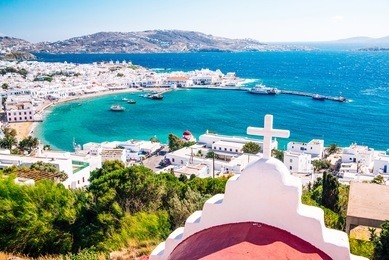 panoramic view of the mykonos town harbor from the above hills on a sunny summer day, mykonos, cyclades, greece