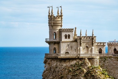castle swallow's nest on the rock in black sea close-up, crimea, russia. it is one of the main landmarks and tourist places of crimea. beautiful view of swallow's nest at the precipice in summer.