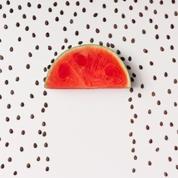 watermelon slice with seeds raining. flat lay. weather concept.