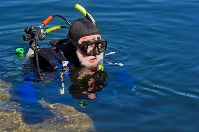 series of images of scuba divers preparing to enter the water.