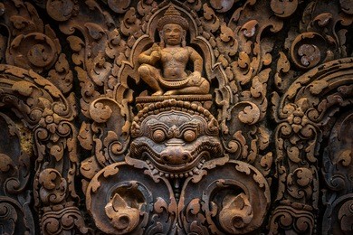 ornate bas-relief on the exterior of the temples of banteay srei in siem reap, cambodia.