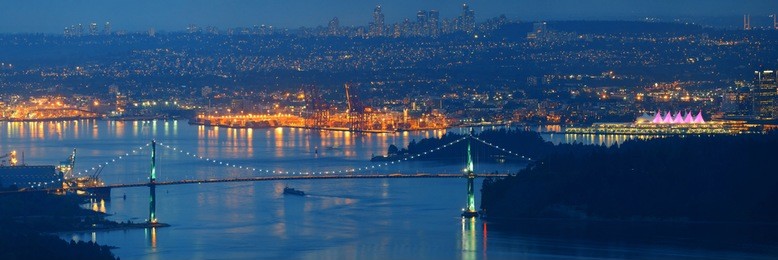 vancouver city mountain top night view with buildings and bridge.