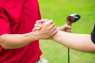 golfer shake hand, spirit sport relationship concept.
