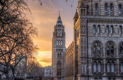 natural history museum at sunset, london uk 