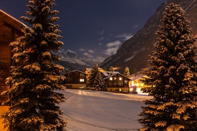 winter night view with clear sky of the tasch valley, the gate to zermatt, switzerland