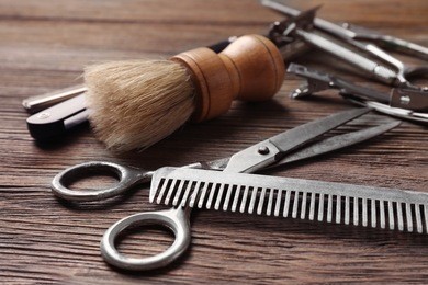 vintage tools of barber shop on wooden background