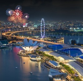 singapore city skyline aerial with firework view during twilight time in singapore national day