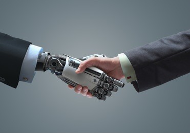 human and robot handshake business relationship symbol