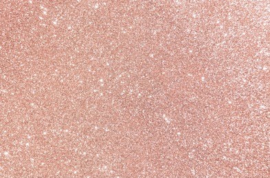 rose gold glitter, defocused abstract holidays lights on background.