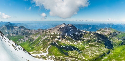 panorama beautiful mountain and glaciers with tree and field on summer with snow and clear sky, view of jungfrau, schilthorn switzerland