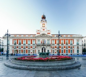the old post office at puerta del sol, km 0, madrid, spain