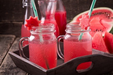 watermelon drink in glasses with slices of watermelon mint and lemon, vintage background ,soft focus