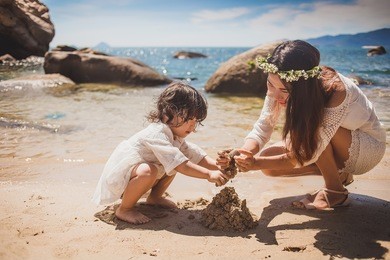 lifestyle portrait mom and daughter in happines at the outside in the meadow.happy loving family. 
mother and child girl playing, kissing and hugging.asian mother and daughter walking on the beach.