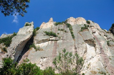 a rock cliff against a blue sky in the early morning at fangdong scenic area on yandangshan mountains located in zhejiang province china.