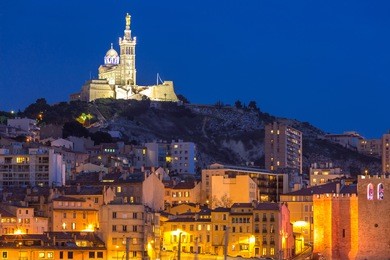 marseille, france at night. the famous european harbour view on the notre dame de la garde