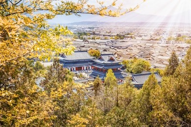 ancient roof in lijiang old town with light ray from sunset, yunnan china