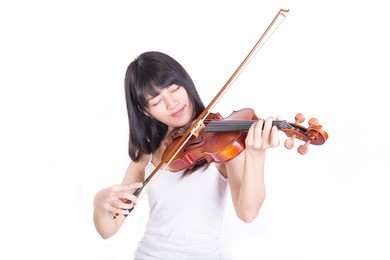 beautiful girl playing the violin, isolated on white background