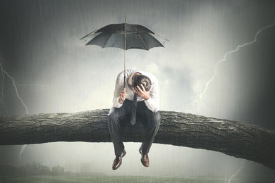 desperate man crying under rain