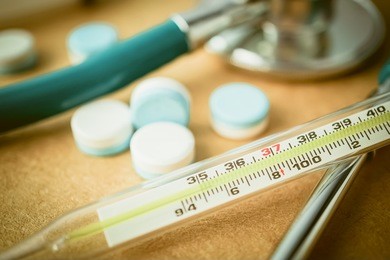 fever thermometer and tablets