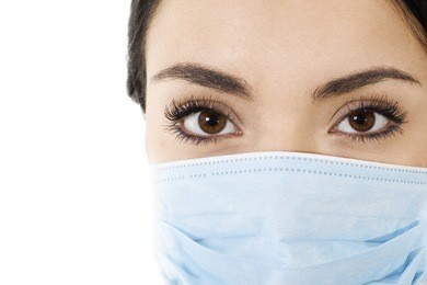 stock image of woman wearing mouth cover mask isolated on white closeup