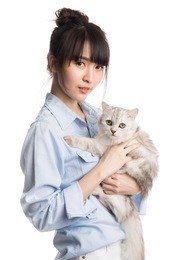 beautiful asian girl holding the cat, isolated on white background