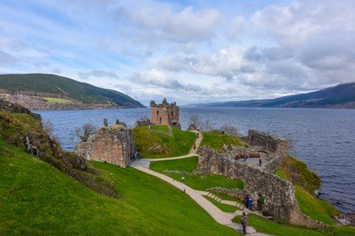 ruins of urquhart castle along loch ness, scotland