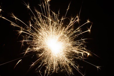 burning sparkler isolated on black background