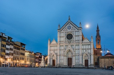 view from the square on the marble facade of basilica di santa croce in the night, florence, italy