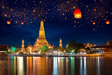 wat arun with krathong lantern, bangkok thailand