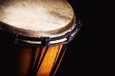 closeup view of wooden djembe, accentuated shapes. 