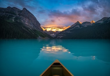 it's quite an awesome experience to wake up early and enjoy the lake louise sunrise from inside a canoe.