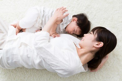 portrait of asian mother and baby sleeping in the room