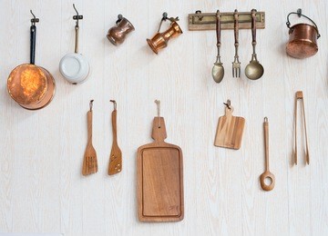 wooden kitchen utensils and frying pan