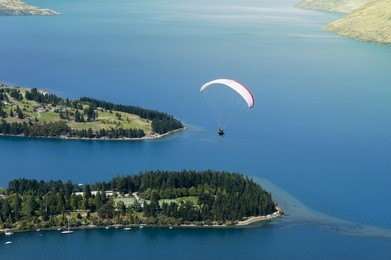 tandem paragliding over lake wakatipu in queenstown, new zealand