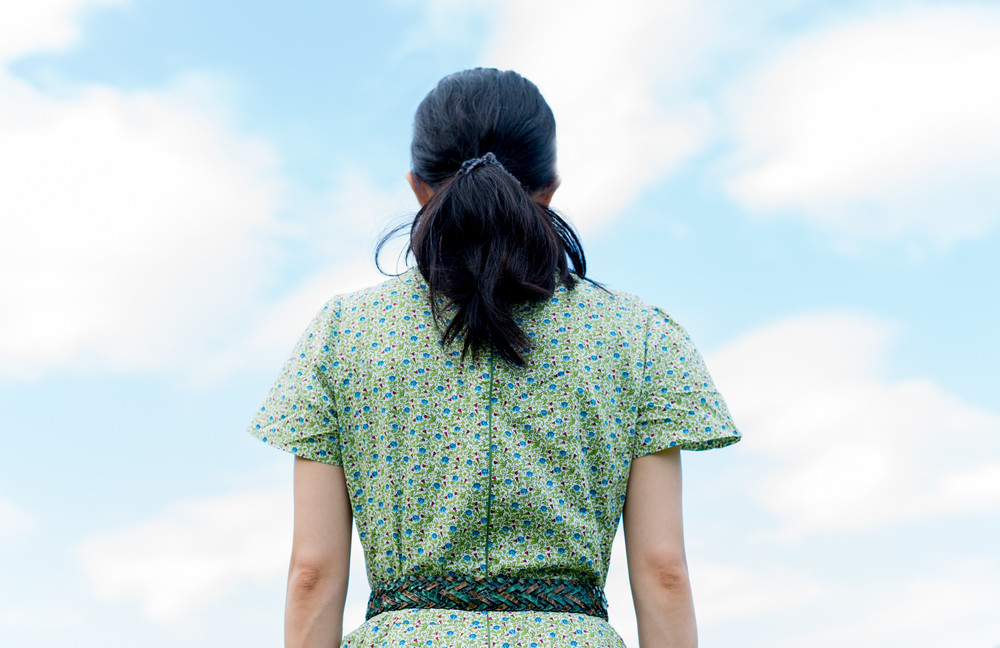 woman on the blue sky background