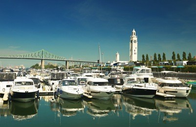 view of the marina with the clock tower in background in the old port of montreal in quebec city, canada