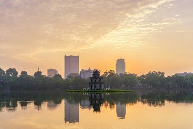 hoan kiem lake (lake of the returned sword) and the turtle tower in hanoi , vietnam