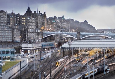 central edinburgh, scotland - landscape view of waverley station, north bridge and edinburgh castle