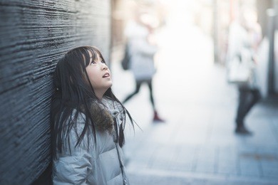 beautiful asian girl looking up on street,gion kyoto japan