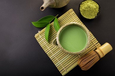 japanese matcha accessories and green tea in bowl