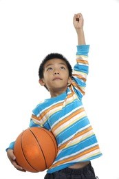 young boy holding a basketball