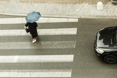 weather nature atmosphere protection relax concept. person with umbrella. someone walking in rain covering himself from water.