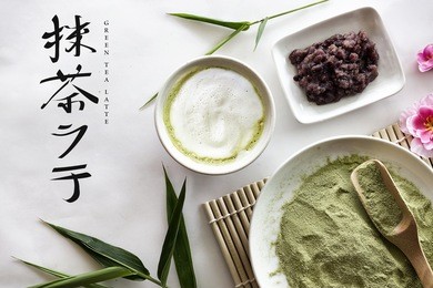 green tea latte on white table background. over light and japan tone character translation - green tea latte 