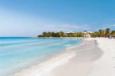 tourists relax on varadero sandy beach. cuba.